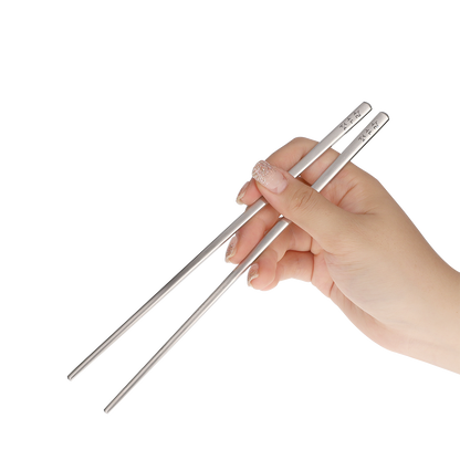 The chopsticks are held in the correct way.