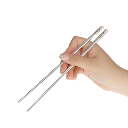 The chopsticks are held in the correct way.