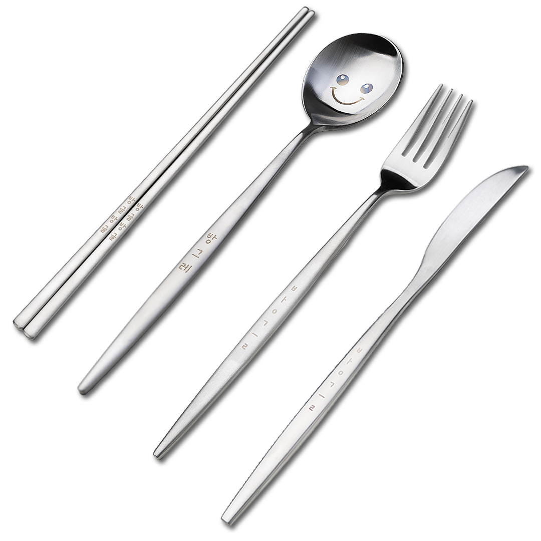 A spoon with a cute face drawn on it, chopsticks with Korean characters on the handle, a fork, and a knife.